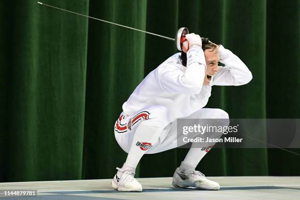 Oliver Shindler of the Ohio State Buckeyes celebrates after defeating Teddy Lombardo of the Columbia Lions during the Division I Men's Fencing...