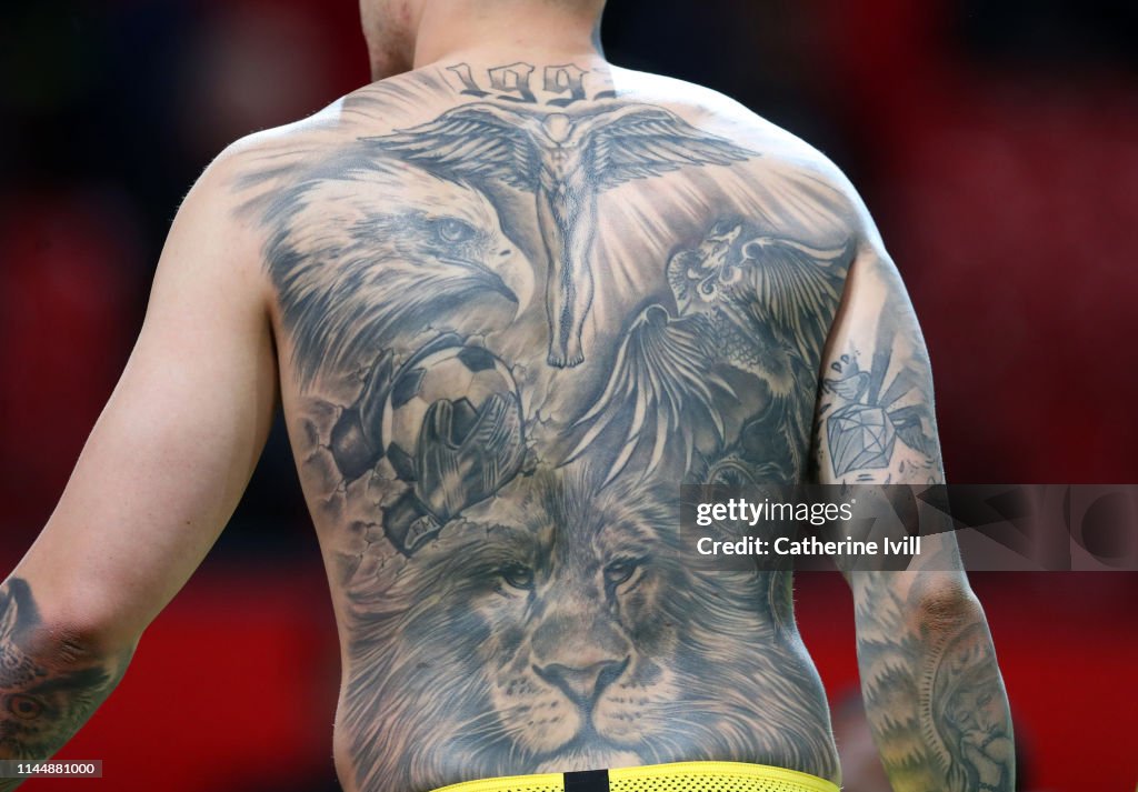 The tattoo on the back of Ederson of Manchester City during the... News  Photo - Getty Images