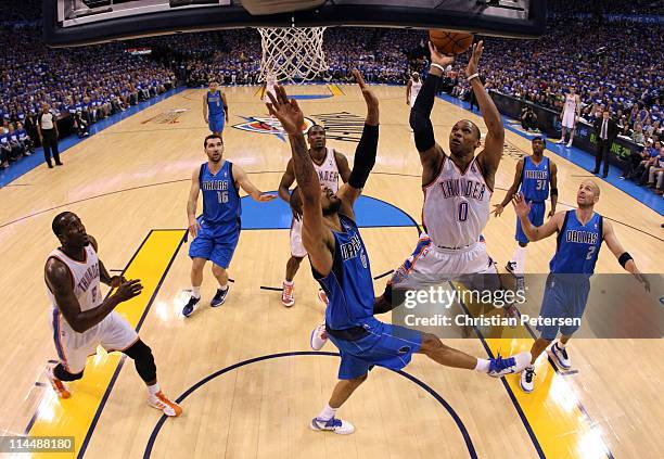Russell Westbrook of the Oklahoma City Thunder goes up for a shot against Tyson Chandler of the Dallas Mavericks in the first half in Game Three of...