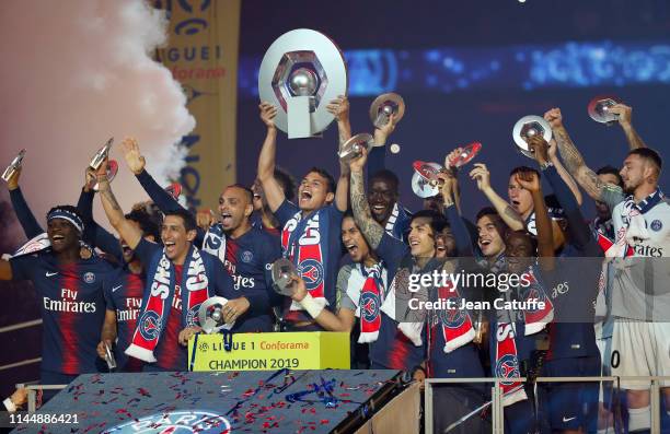 Thiago Silva of PSG - holding the trophy - and teammates celebrate the title of 'French Champion 2019' during the trophy ceremony following the...