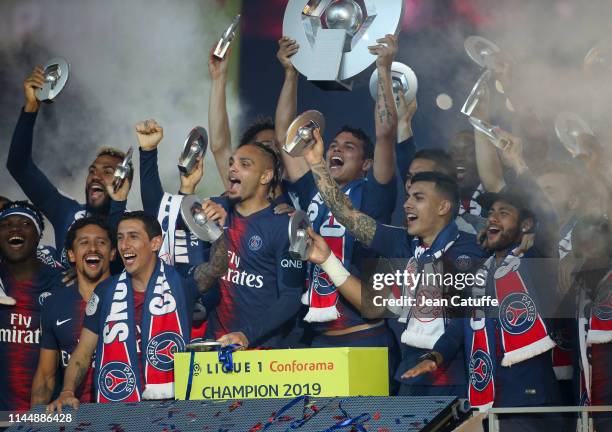 Thiago Silva of PSG - holding the trophy - surrounded by Marquinhos, Angel Di Maria, Layvin Kurzawa, Leandro Paredes, Neymar Jr and teammates...