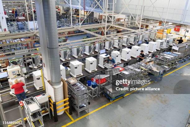 May 2019, North Rhine-Westphalia, Bielefeld: Dishwashers are on a production line at Miele & Cie. KG. Miele is a German manufacturer of household and...