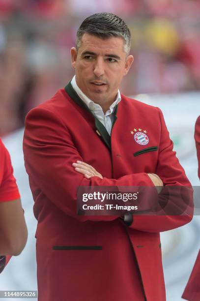 Roy Makaay looks on after the Bundesliga match between FC Bayern Muenchen and Eintracht Frankfurt at Allianz Arena on May 18, 2019 in Munich, Germany.