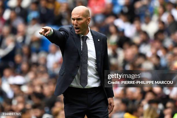 Real Madrid's French coach Zinedine Zidane reacts during the Spanish League football match between Real Madrid and Real Betis at the Santiago...