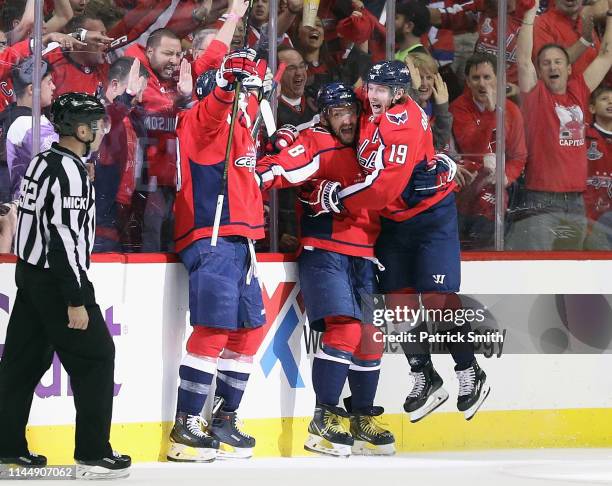 Tom Wilson, Alex Ovechkin and Nicklas Backstrom of the Washington Capitals celebrate Wilson's goal at 6:23 of the first period against the Carolina...