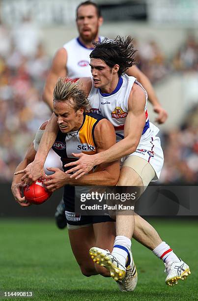 Easton Wood of the Bulldogs tackles Mark Nicoski of the Eagles during the round nine AFL match between the West Coast Eagles and the Western Bulldogs...