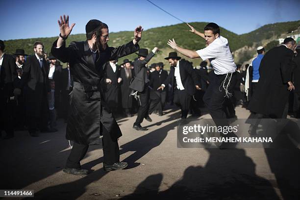 Ultra-Orthodox Jews dance during celebrations at the grave site of Rabbi Shimon Bar Yochai in the northern Israeli village of Meron in the early...