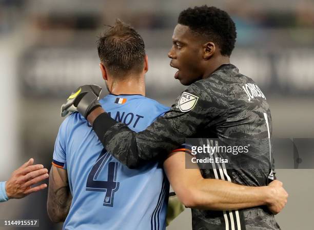 Maxime Chanot and Sean Johnson of New York City FC celebrate the win over the Chicago Fire at Yankee Stadium on April 24, 2019 in the Bronx borough...