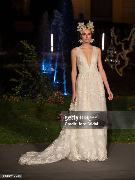 Model walks the runway at the Marchesa show during Valmont Barcelona Bridal Fashion Week at Jardins del Palau de Pedralbes on April 24, 2019 in...