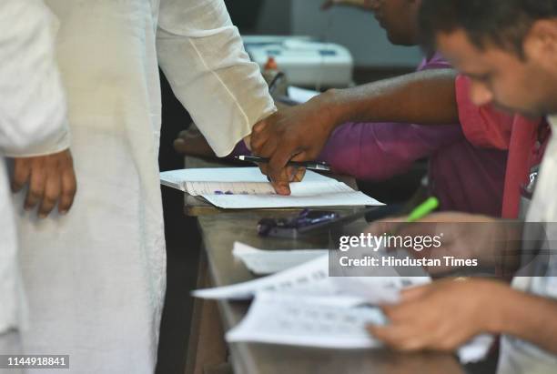 Voter seen giving thumb impression during polling for the seventh and last phase of Lok Sabha electionsl, at Diamond Harbour constituency, on May 19,...