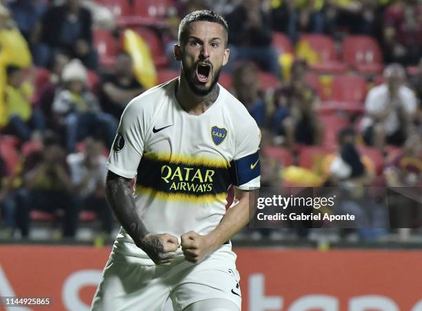 Dario Benedetto of Boca Juniors celebrates after scoring the second goal of his team via penalty during a group G match between Deportes Tolima and...
