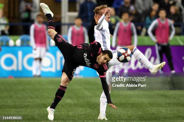 Victor Rodriguez of Seattle Sounders and Jackson Yueill of San Jose Earthquakes collide in the second half during their game at CenturyLink Field on...