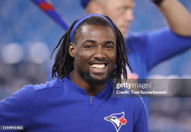 Alen Hanson of the Toronto Blue Jays smiles as he warms up during batting practice before the start of MLB game action against the San Francisco...
