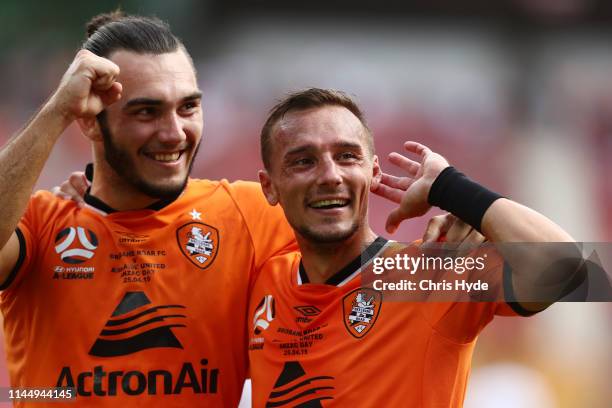 Eric Bautheac and Nicholas D'Agostino of Roar celebrate a goal during the round 27 A-League match between the Brisbane Roar and Adelaide United at...