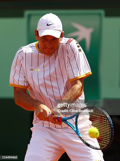 Jan Hajek of Czech Republic plays a backhand during the men's singles round one match between Jan Hajek of Czech Republic and Jo-Wilfried Tsonga of...