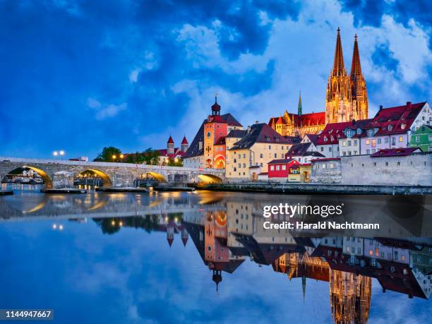 old town with danube river at night, regensburg, bavaria, germany - river danube stock pictures, royalty-free photos & images