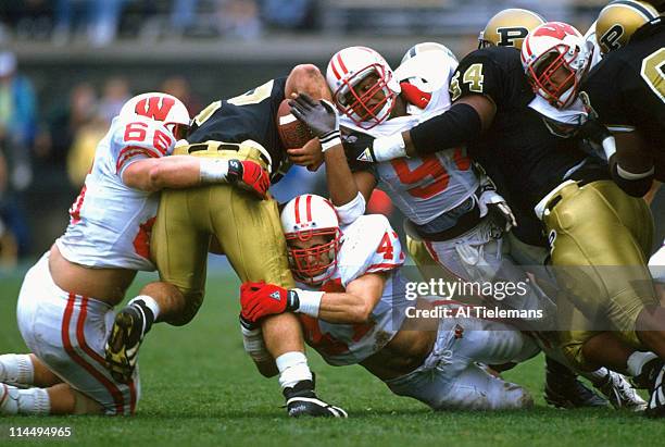 Purdue Mike Alstott in action during tackle by Wisconsin Yusef Burgess and defense at Ross-Ade Stadium. West Lafayette, IN CREDIT: Al Tielemans