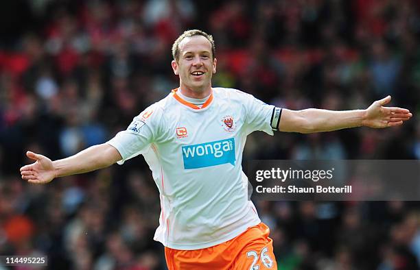 Charlie Adam of Blackpool celebrates as scores their first goal from a free kick during the Barclays Premier League match between Manchester United...