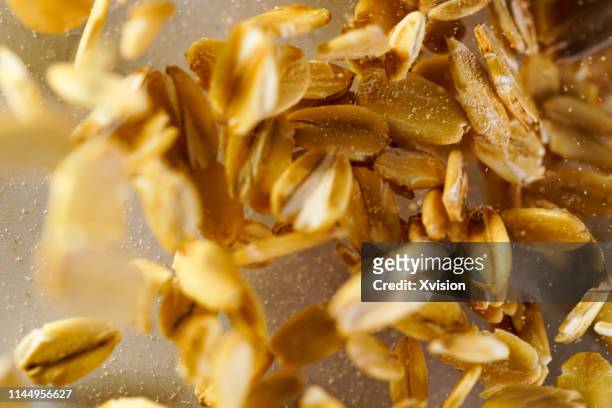 oats flake dancing captured with high speed sync"n - oat stock pictures, royalty-free photos & images
