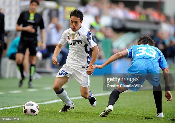 Yuto Nagatomo of FC Inter Milan and Ciro Capuano of Catania Calcio compete for the ball during the Serie A match between FC Internazionale Milano and...