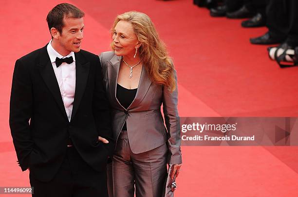 Faye Dunaway and Liam O'Neill attend the "Les Bien-Aimes" premiere at the Palais des Festivals during the 64th Cannes Film Festival on May 22, 2011...