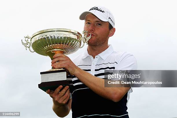 Michael Hoey of Northern Ireland holds the trophy after winning the Madeira Islands Open on May 22, 2011 in Porto Santo Island, Portugal.