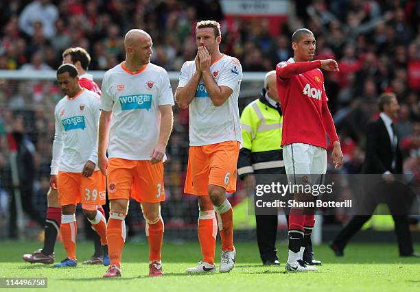 Stephen Crainey and Ian Evatt of Blackpool look dejected as Blackpool are relegated after the Barclays Premier League match between Manchester United...