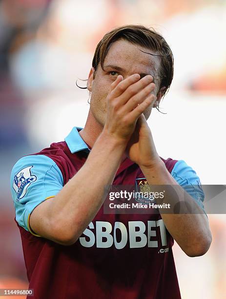 Scott Parker of West Ham salutes the fans at the end of the Barclays Premier League match between West Ham United and Sunderland at Boleyn Ground on...