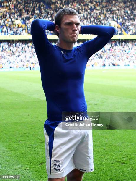 Craig Gardner of Birmingham City looks dejected after his team were relegated during the Barclays Premier League match between Tottenham Hotspur and...