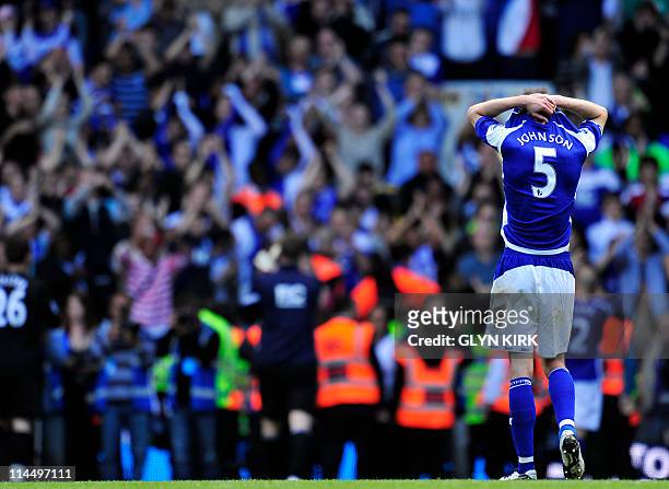 Birmingham City's English defender Roger Johnson shows his disappointment after their 2-1 defeat in the English Premier League football match between...