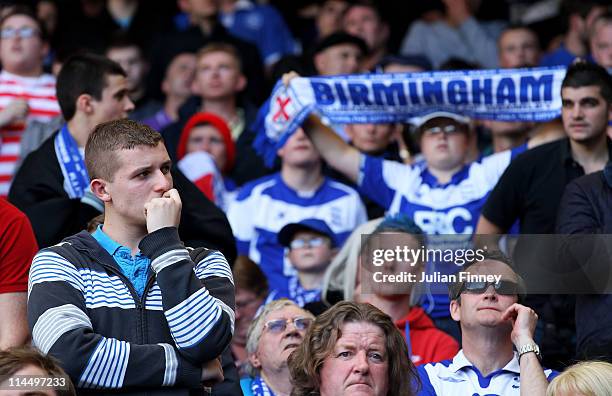 Birmingham City fan looks dejected after his team was relegated during of the Barclays Premier League match between Tottenham Hotspur and Birmingham...