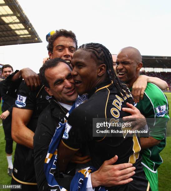 Manager Roberto Martinez of Wigan celebrates with Hugo Rodallega after victory during the Barclays Premier League match between Stoke City and Wigan...