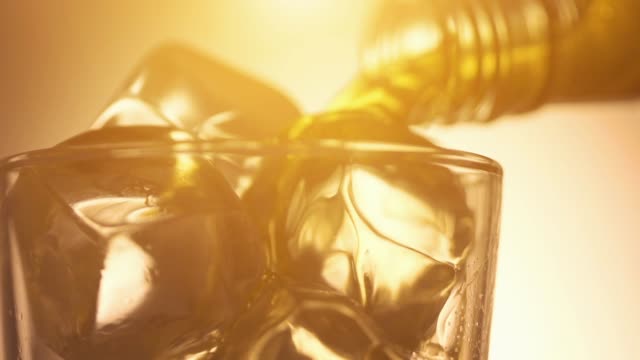Cinemagraph loop - pouring scotch whiskey over ice