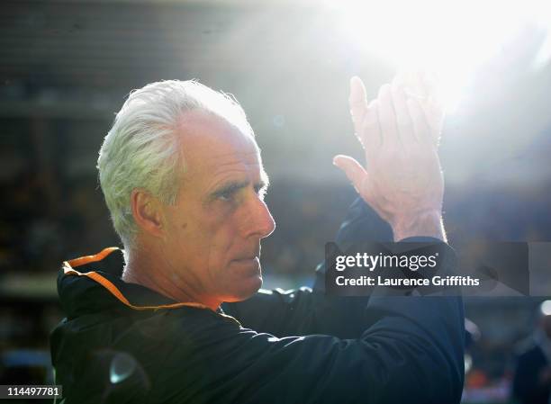 Mick McCarthy of Wolverhampton Wanders applauds the fans after avoiding relegation during the Barclays Premier League match between Wolverhampton...