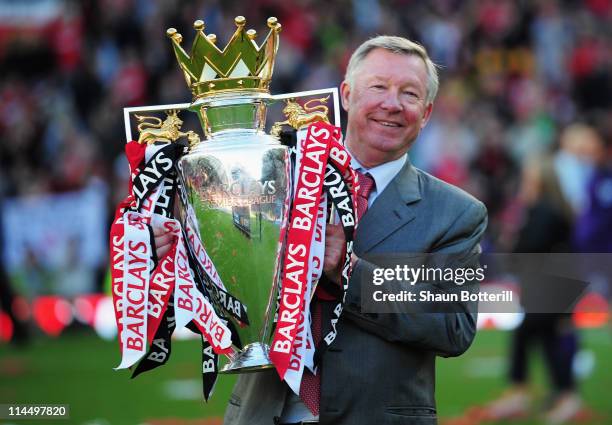 Sir Alex Ferguson manager of Manchester United lifts the Premier League trophy after the Barclays Premier League match between Manchester United and...