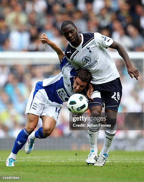 Matt Derbyshire of Birmingham City is challenged by Ledley King of Tottenham Hotspur during the Barclays Premier League match between Tottenham...