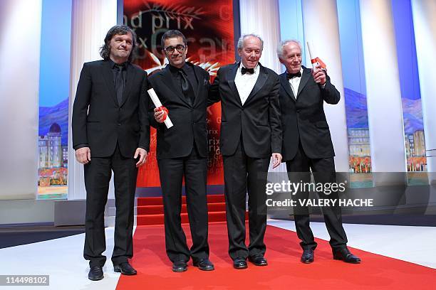 President of the Un Certain Regary jury Emir Kusturica poses with Turkish director Nuri Bilge Ceylan and Belgian directors Jean-Pierre Dardenne and...
