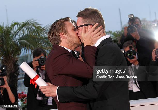 Actor Ryan Gosling kisses Director Nicolas Winding Refn after he wins Award for Best Director for his film "Drive" during the Palme D'Or Winners...