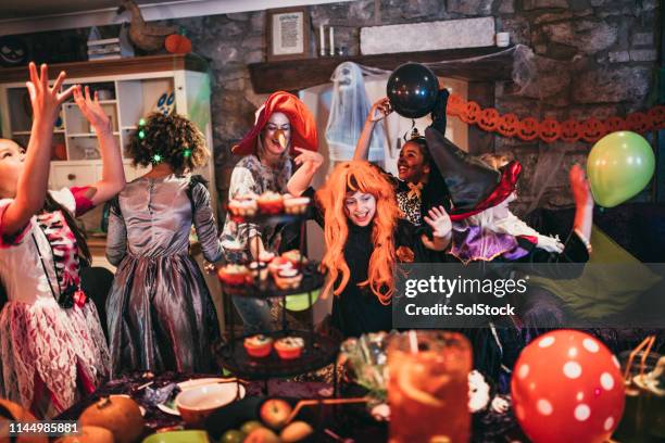 group of friends dancing together - halloween party imagens e fotografias de stock