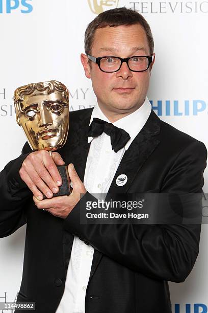 Hugh Fearnley Whittingstall poses with his Best Features Award in front of the winners boards at The Phillips British Academy Awards 2011 at The...