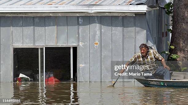 Everett Rodgers attempts to retrieve belongings from his flooded home along the Yazoo River near Yazoo City May 22, 2011 in Yazoo County,...