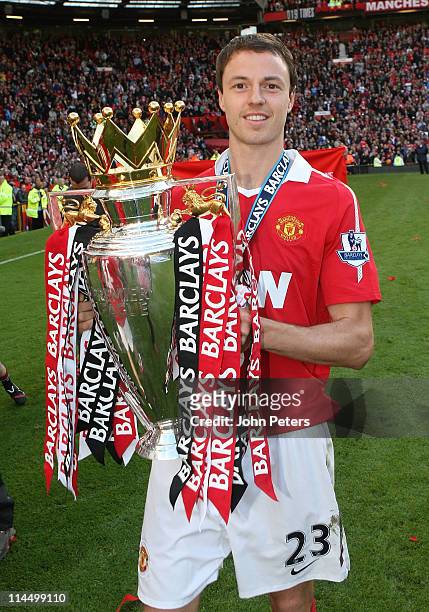 Jonny Evans of Manchester United celebrates with the Barclays Premier League trophy after the Barclays Premier League match between Manchester United...