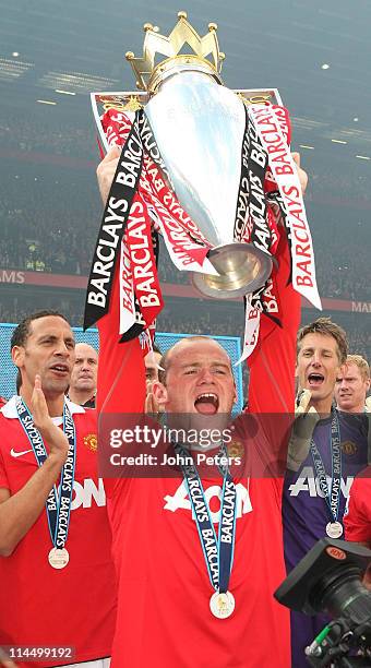 Wayne Rooney of Manchester United lifts the Barclays Premier League trophy after the Barclays Premier League match between Manchester United and...
