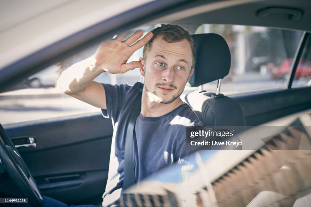 Young man in car