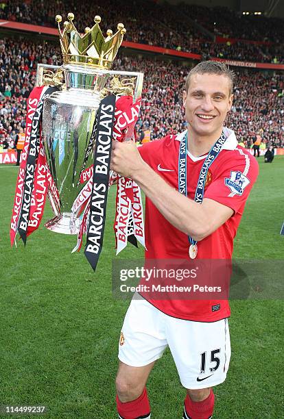 Nemanja Vidic of Manchester United celebrates with the Barclays Premier League trophy after the Barclays Premier League match between Manchester...