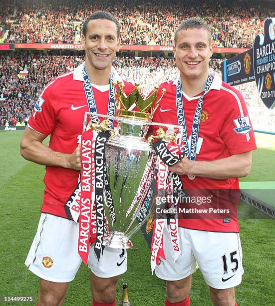 Rio Ferdinand and Nemanja Vidic of Manchester United celebrate with the Barclays Premier League trophy after the Barclays Premier League match...