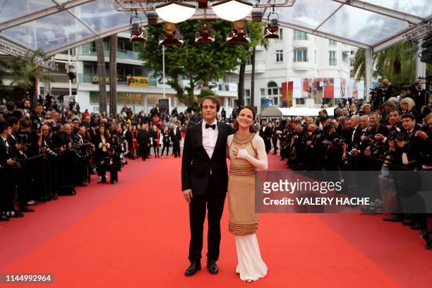 Austrian actress Valerie Pachner and German actor August Diehl pose as they arrive for the screening of the film "A Hidden Life" at the 72nd edition...