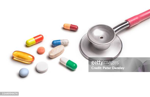 doctor over prescribing medicine - surgical tools stock pictures, royalty-free photos & images