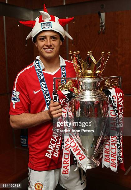 Javier Hernandez of Manchester United poses in the dressing room with the Barclays Premier League trophy after the Barclays Premier League match...