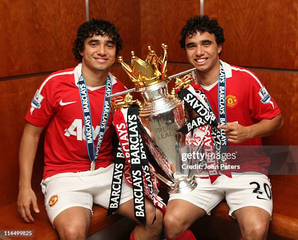 Rafael Da Silva and Fabio Da Silva of Manchester United pose in the dressing room with the Barclays Premier League trophy after the Barclays Premier...